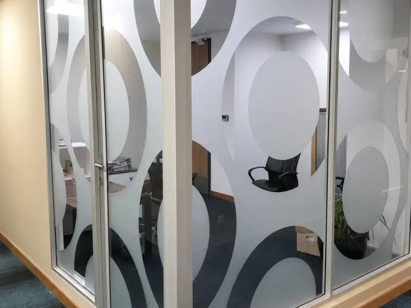 Frosted window film with a circle pattern on Bank Gaborone office partitions