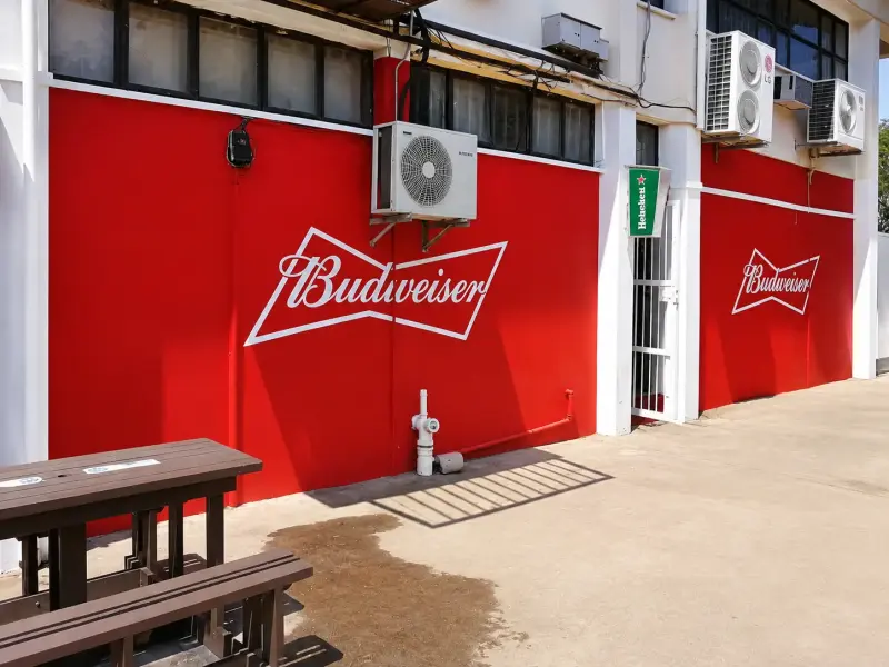 Painted Budweiser wall graphics on a building exterior