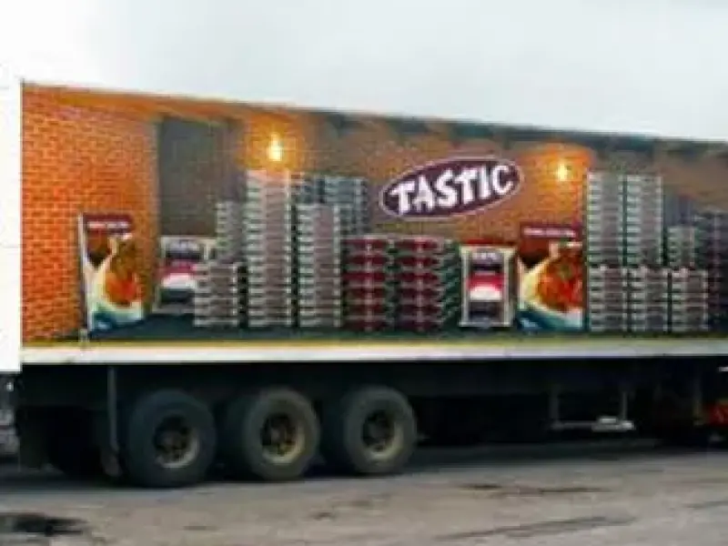 Tastic branded truck trailer curtain with printed product graphics