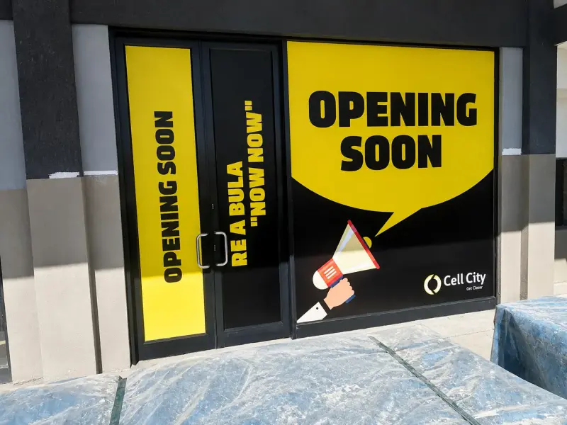 Cell City shopfront with Opening Soon window vinyl