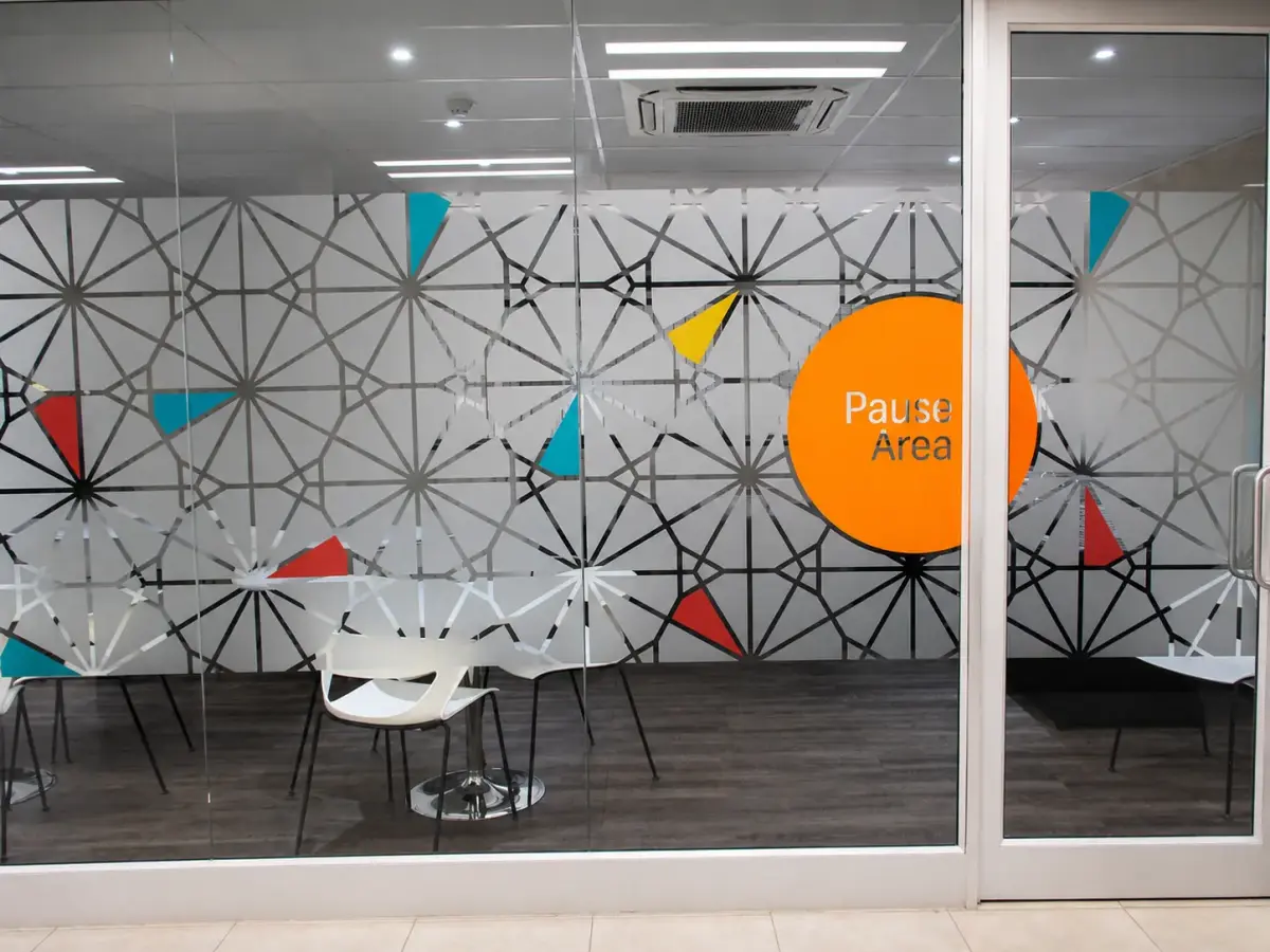 Patterned frosted window film with a Pause Area graphic in an FNB branch