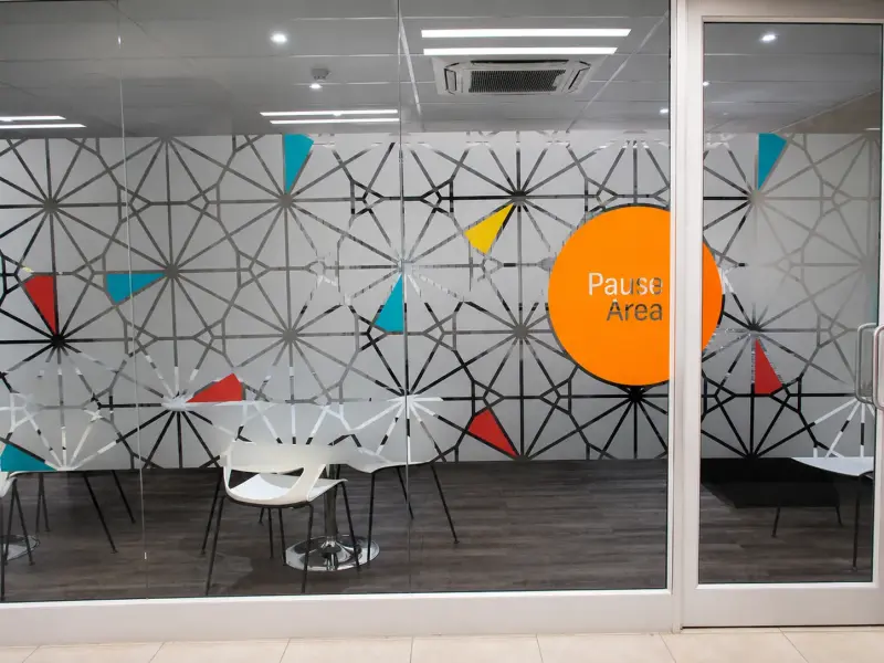 Patterned frosted window film with a Pause Area graphic in an FNB branch