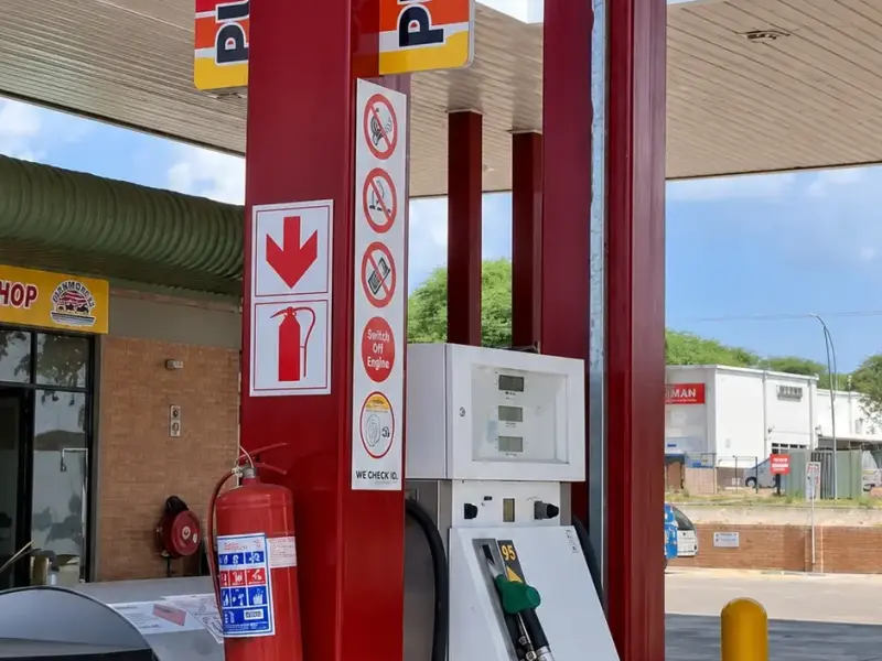 Branded fuel pump and Pump 8 identification sign on a forecourt