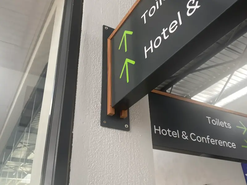 Projecting wayfinding signs for toilets and the hotel and conference centre