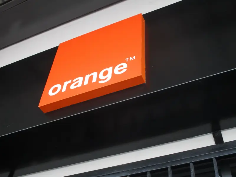 Three-dimensional illuminated Orange logo sign