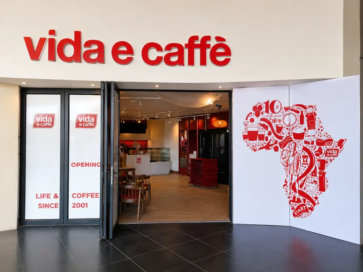 vida e caffe shopfront with fascia sign and printed Africa-map wall graphic