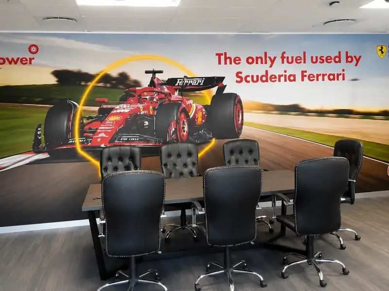 Motorsport-themed wall mural in a Shell branded boardroom